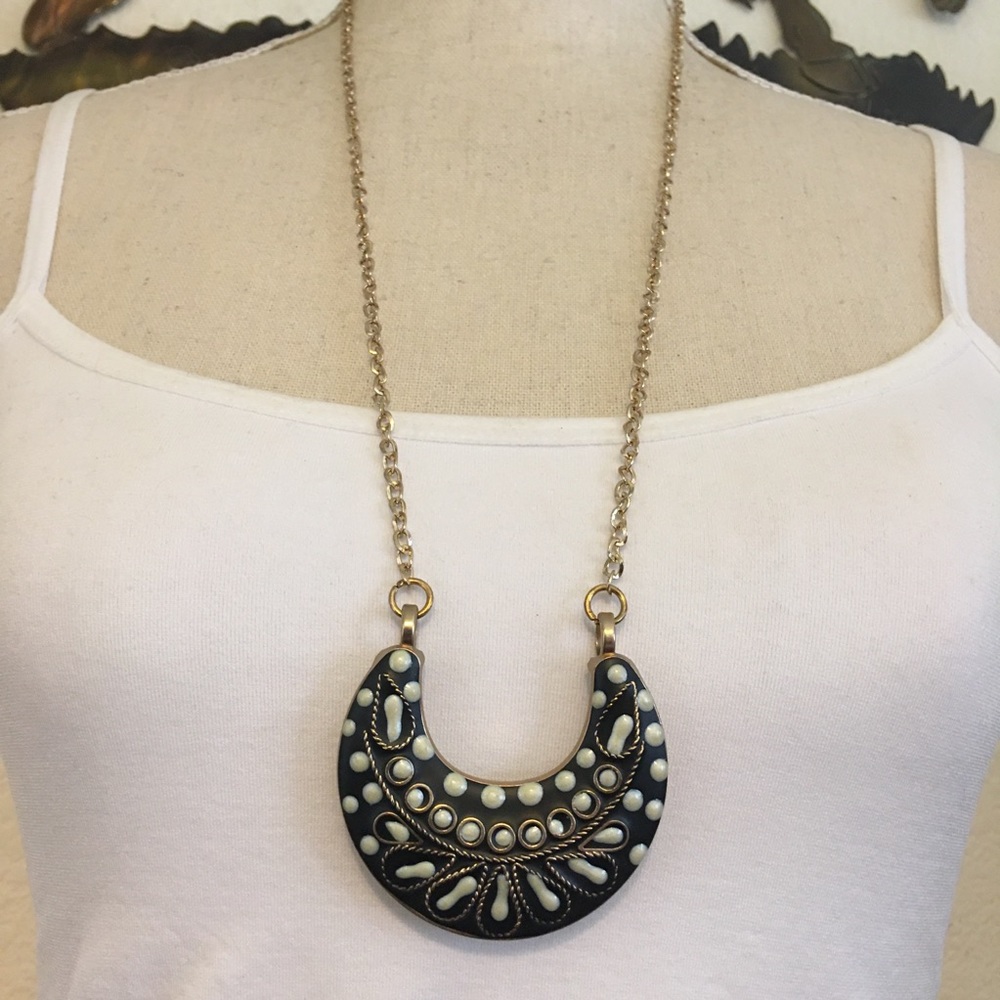 Black and cream enamel medallion on gold chain